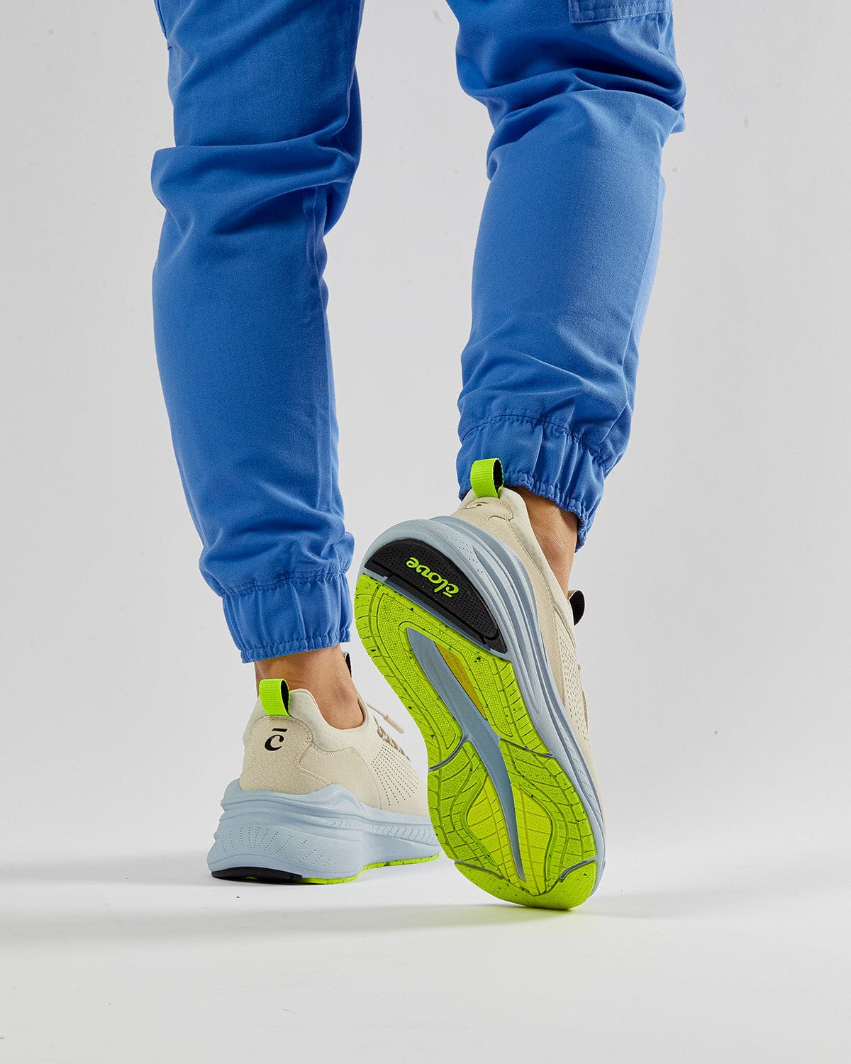forte-sand_Model_Profile_Back_View_Walking_Blue_Pants_Clarino_Material