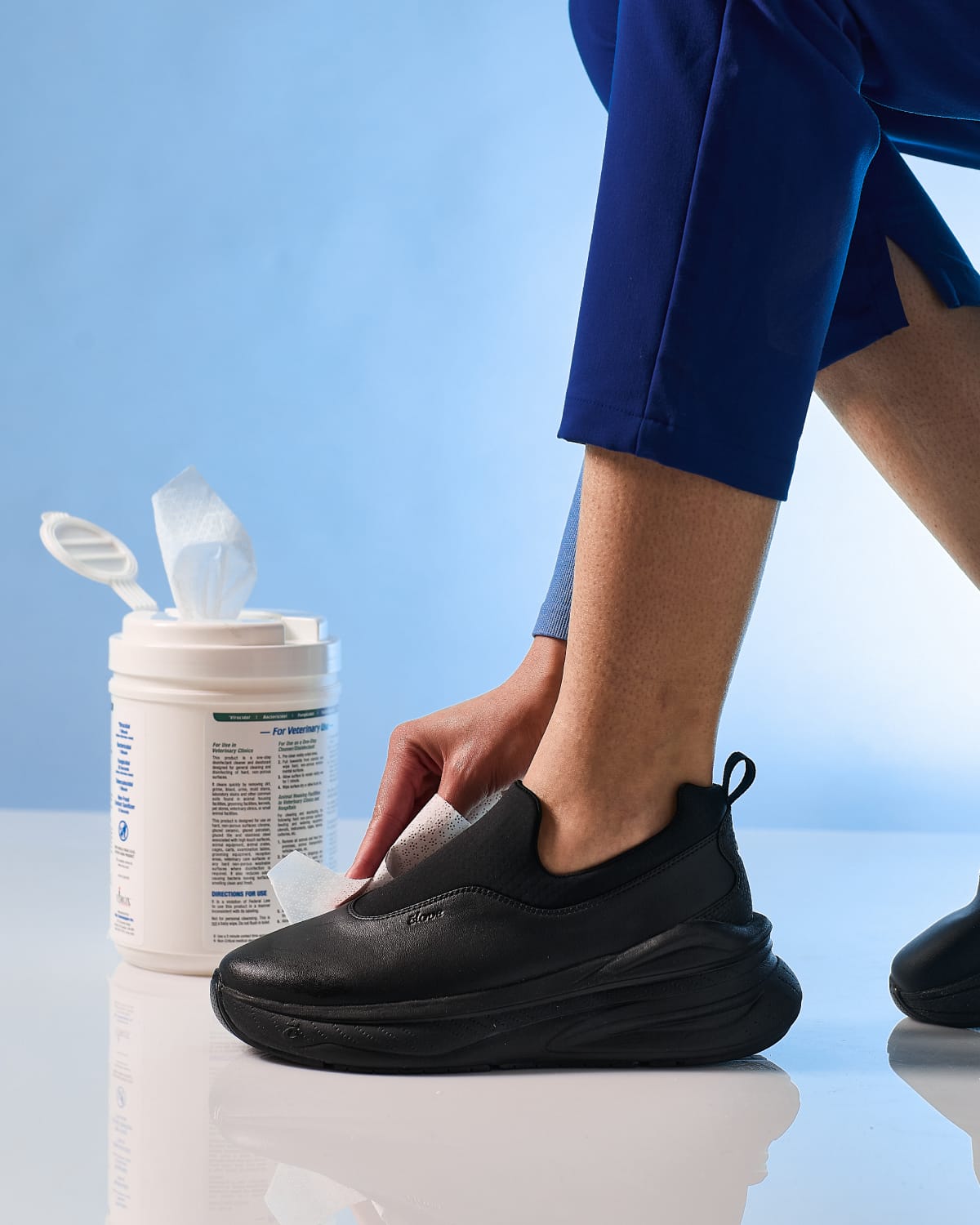ona-all-black-option-Model_Wiping_Shoe_In_Use_Ankle_No_socks